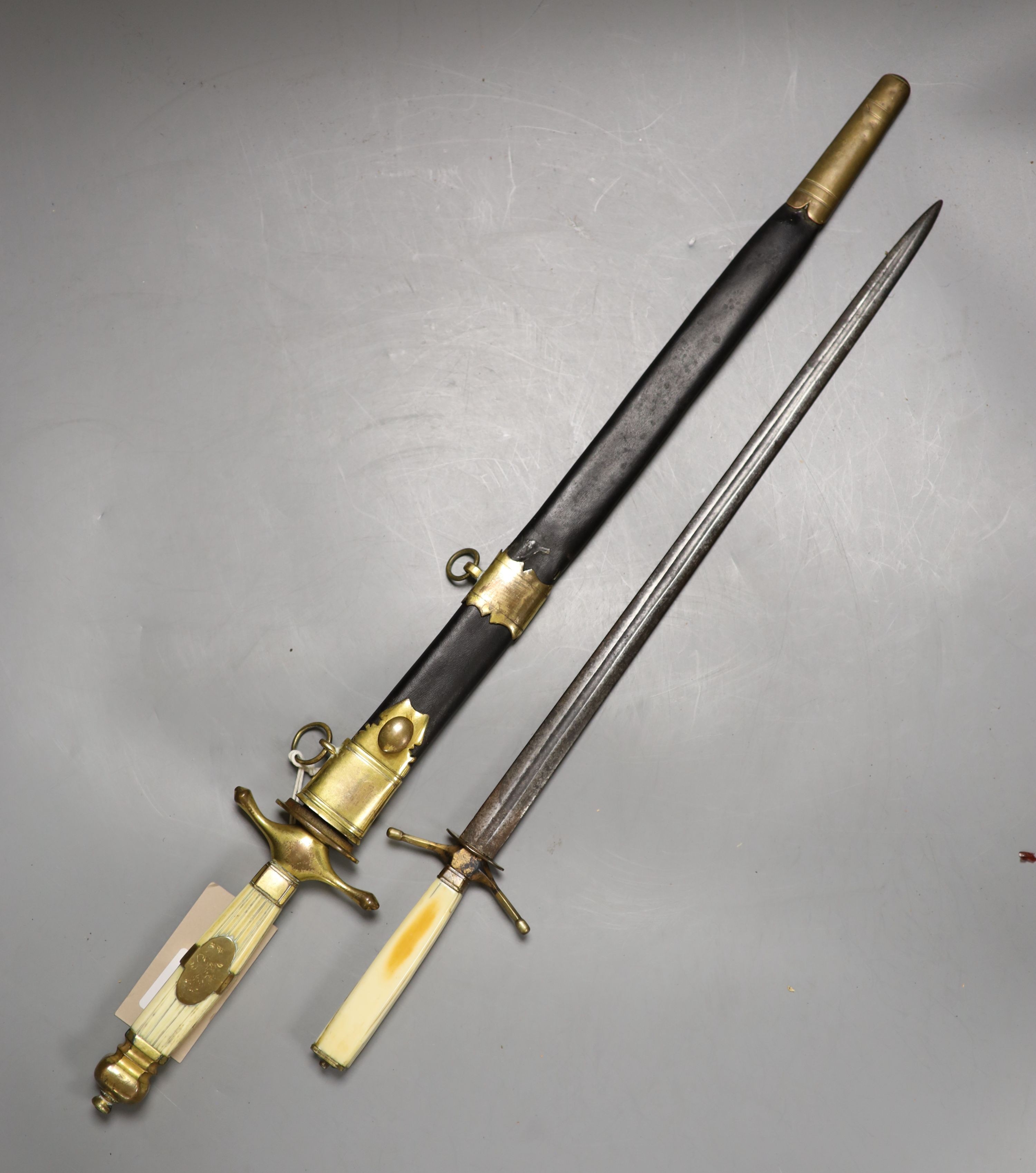 A Georgian naval dirk 41 cm flattened diamond blade etched EDWARD EDWARDS OWEN 1794-1838., Grip with engraved central copper band with traces of a rampart lion. Contained in its copper gilt mounted leather scabbard. Toge